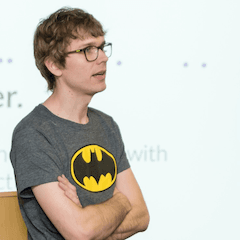 Photo of Rouan doing a talk at a meetup